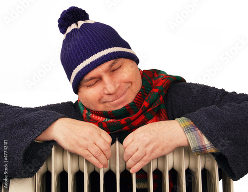 man basking in the heater.
