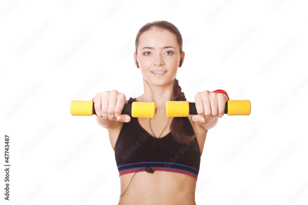 woman lifting dumbbells - in focus only dumbbells woman lifting dumbbells - in focus only dumbbells