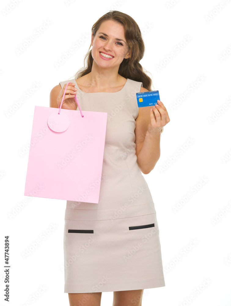 Smiling young woman with shopping bags and credit card Smiling young woman with shopping bags and credit card