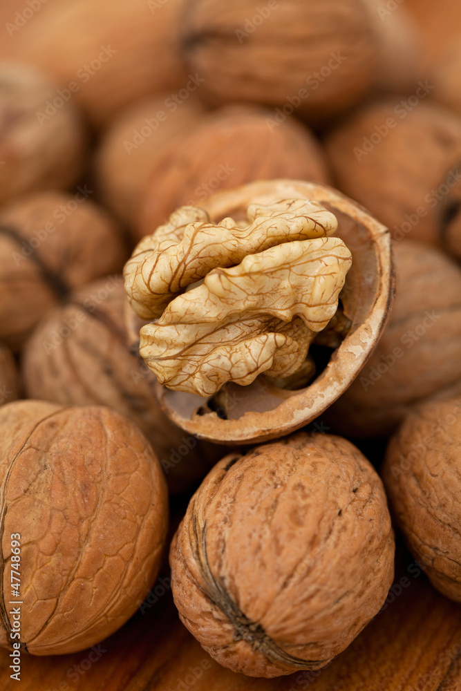walnut on wooden table walnut on wooden table