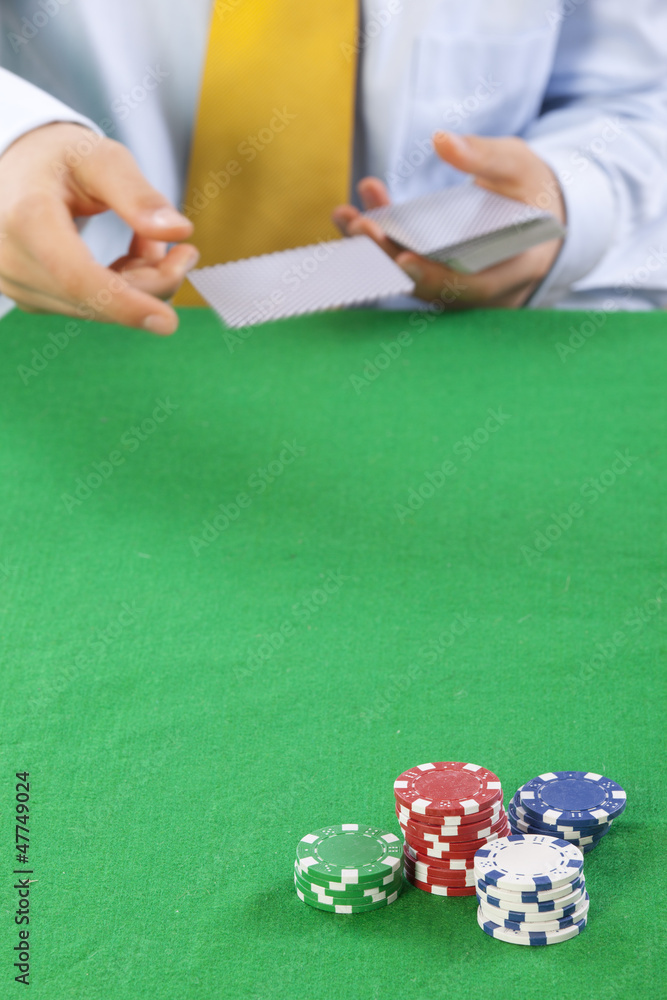 poker player with a yellow tie serving cards poker player with a yellow tie serving cards