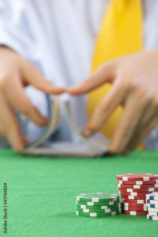 Two hands, shuffling a deck of cards of poker Two hands, shuffling a deck of cards of poker