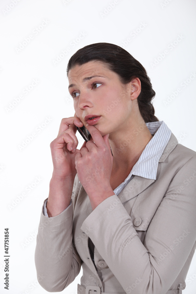 Worried businesswoman on a cellphone Worried businesswoman on a cellphone