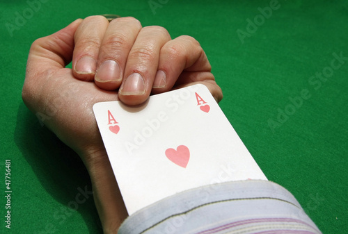 Photos cheating with an ace of hearts in the hole