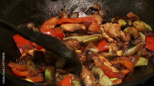 Chinese food in wok, mixing, 2 clips sequence photo