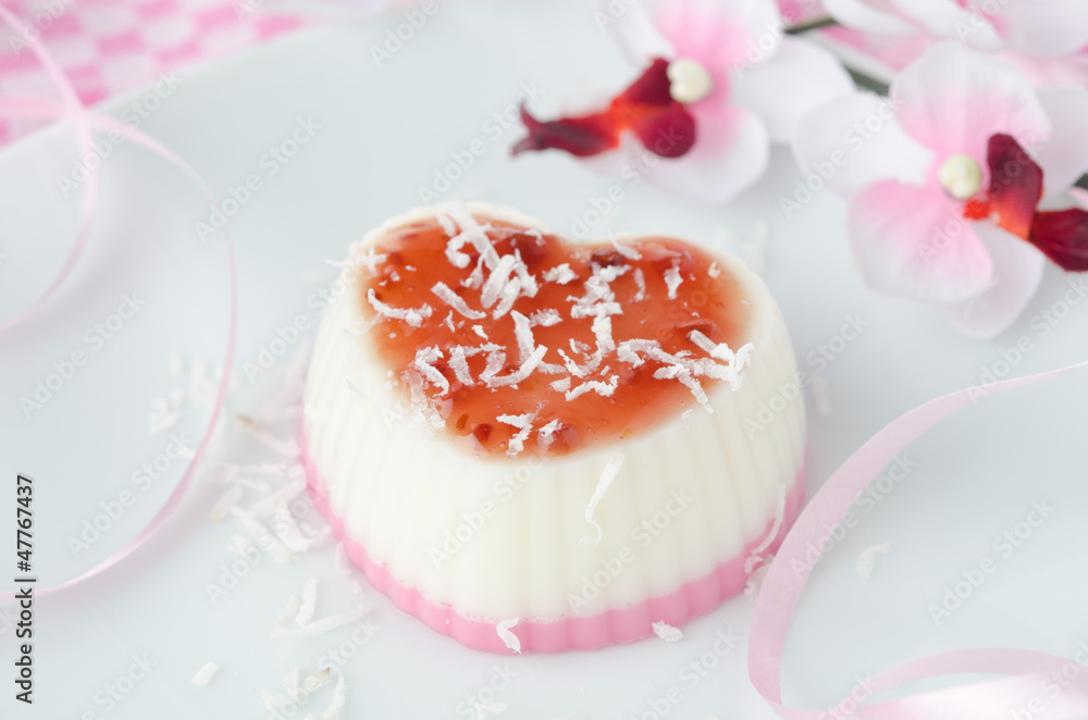 two-layer dessert with coconut creamin the form of heart closeup two-layer dessert with coconut creamin the form of heart closeup