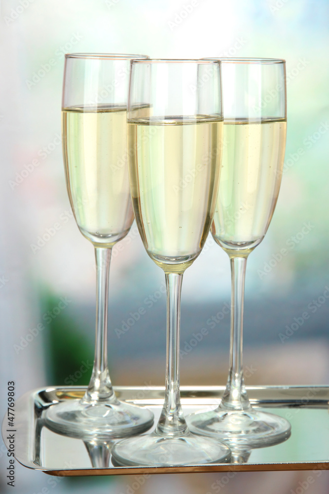 Corporate party: sparkling champagne glasses on tray Corporate party: sparkling champagne glasses on tray