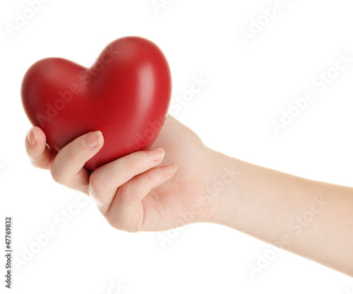 Red heart in woman hand  isolated on white