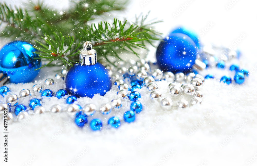 Christmas blue and silver decorations on snow Christmas blue and silver decorations on snow