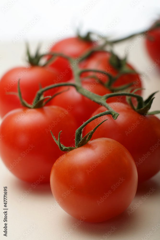 Cherry tomatos on white background