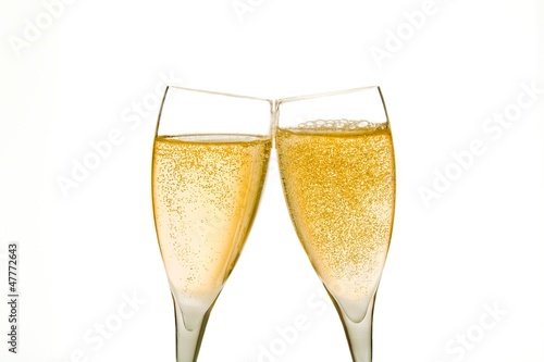cheers, two champagne glasses with gold bubbles