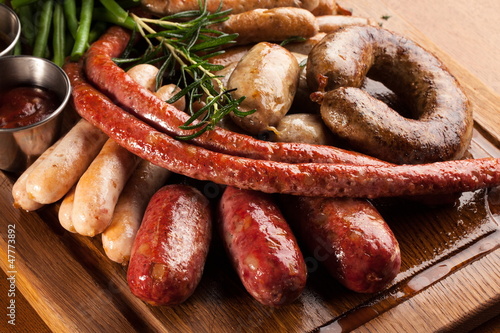 Assortment of grilled sausages.