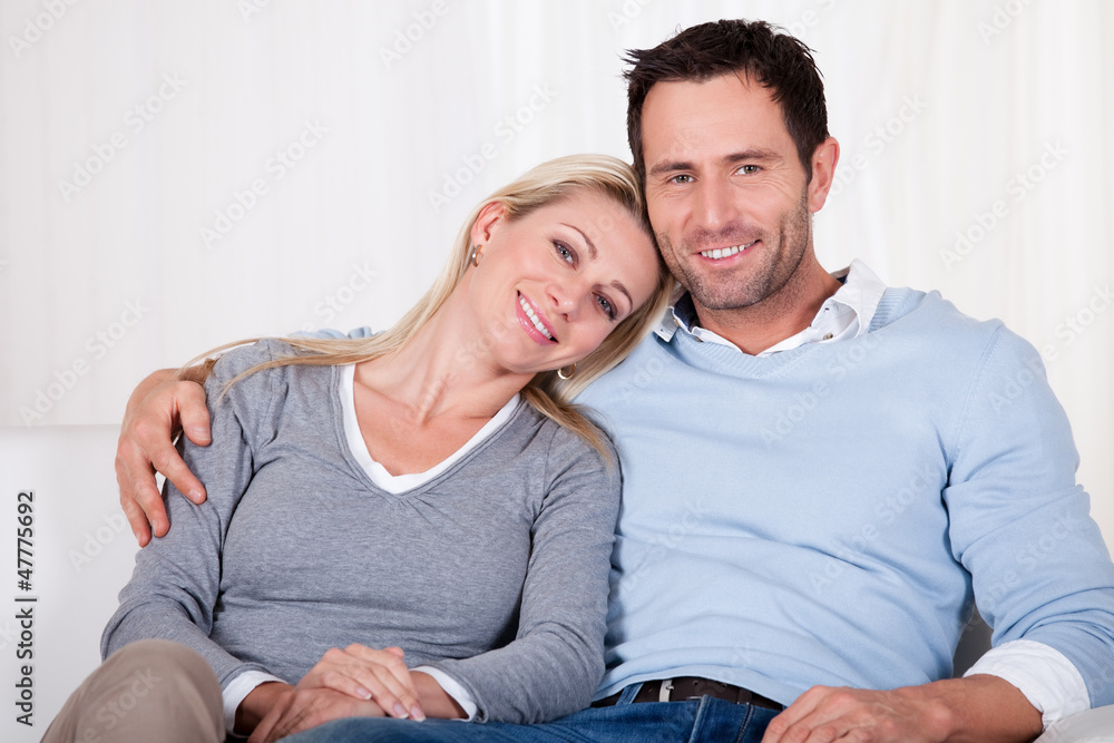 Affectionate couple relaxing on a sofa