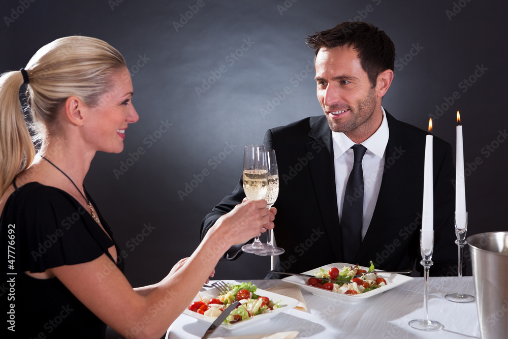 Romantic couple toasting each other Romantic couple toasting each other