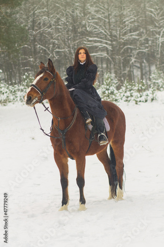 Beautiful woman and horse in winter © asayenka