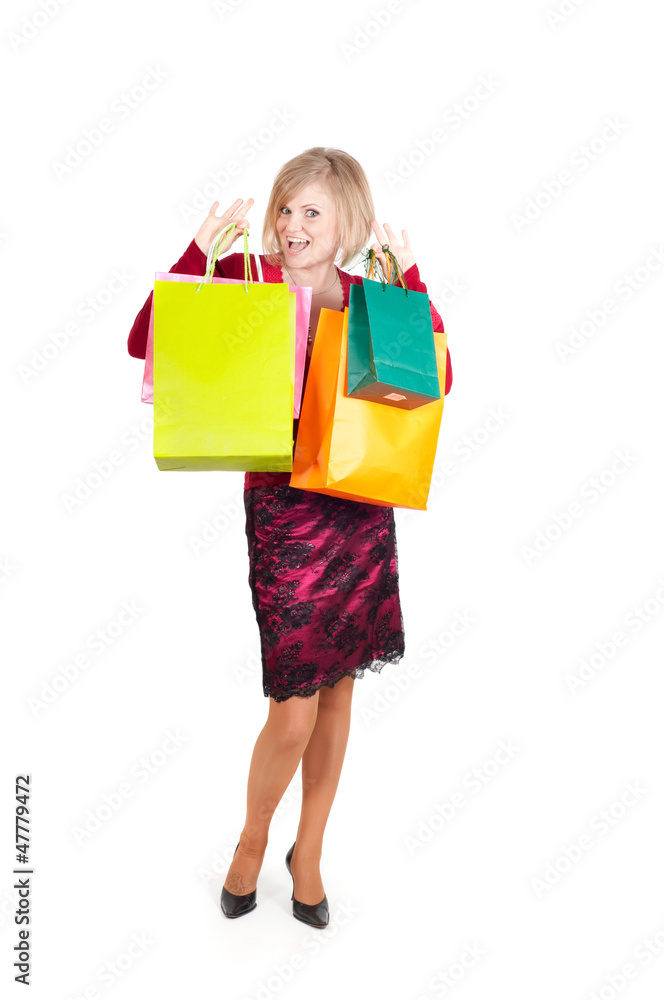 Beautiful woman with multicolored shopping bags
