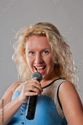 Woman singing in microphone
