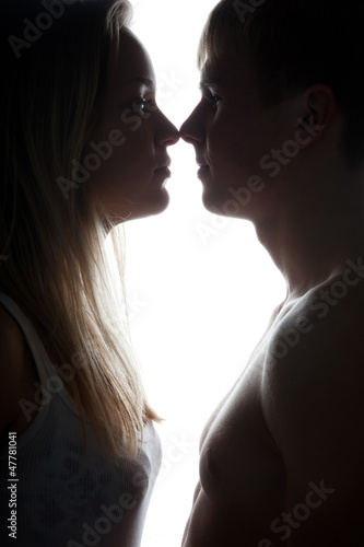 Silhouette of young boy and girl
