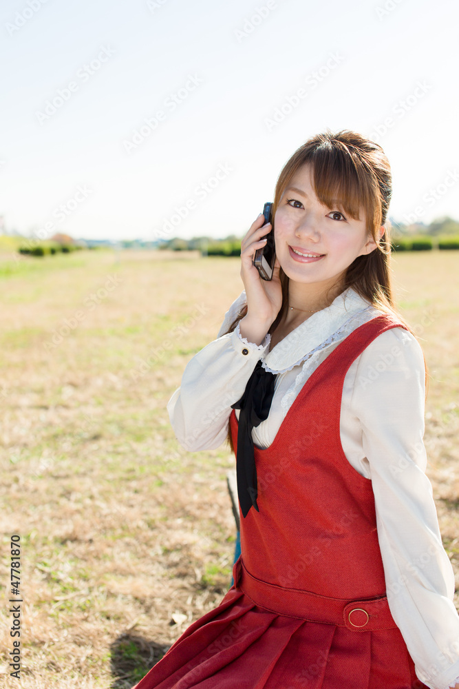 Beautiful asian woman using a cellular Beautiful asian woman using a cellular