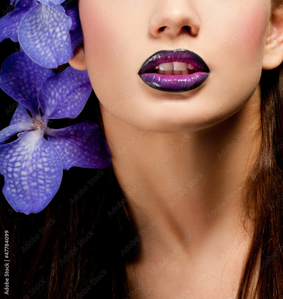 Fototapeta premium Fashionable beautiful woman with orchid in her hair