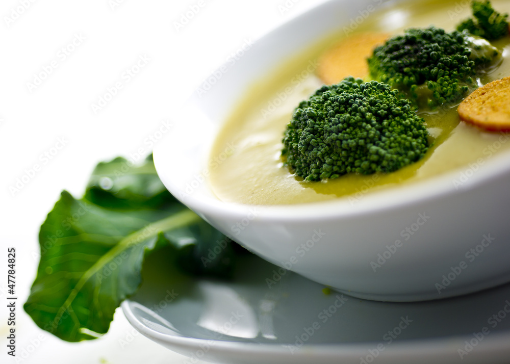 Cream soup with dried crusts isolated on white Cream soup with dried crusts isolated on white