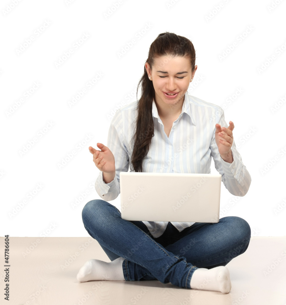 A college girl sitting on the floor with laptop A college girl sitting on the floor with laptop