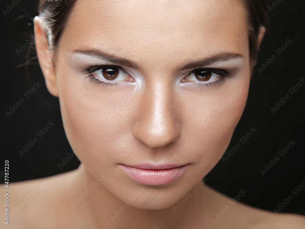 Obraz premium A portrait of a beautiful woman isolated on black background