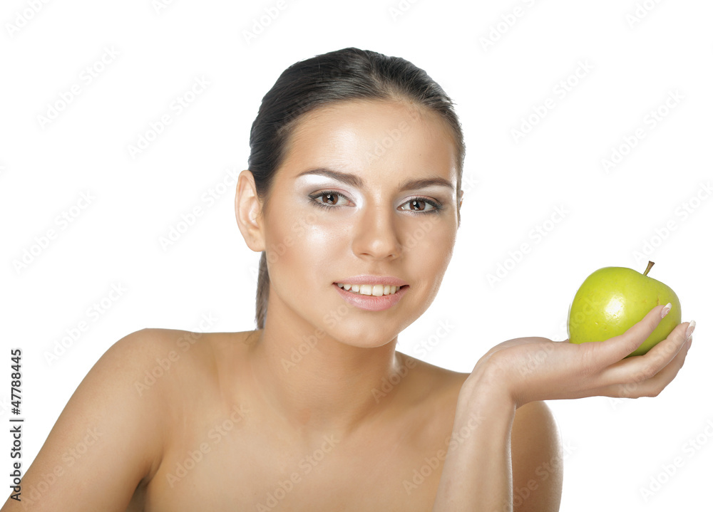 A portrait of beautiful young woman with a green apple A portrait of beautiful young woman with a green apple