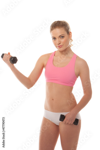 Beautiful woman working with dumbbells