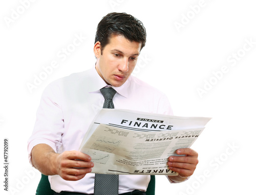 Close-up portrait of a businessman reading newspaper photo