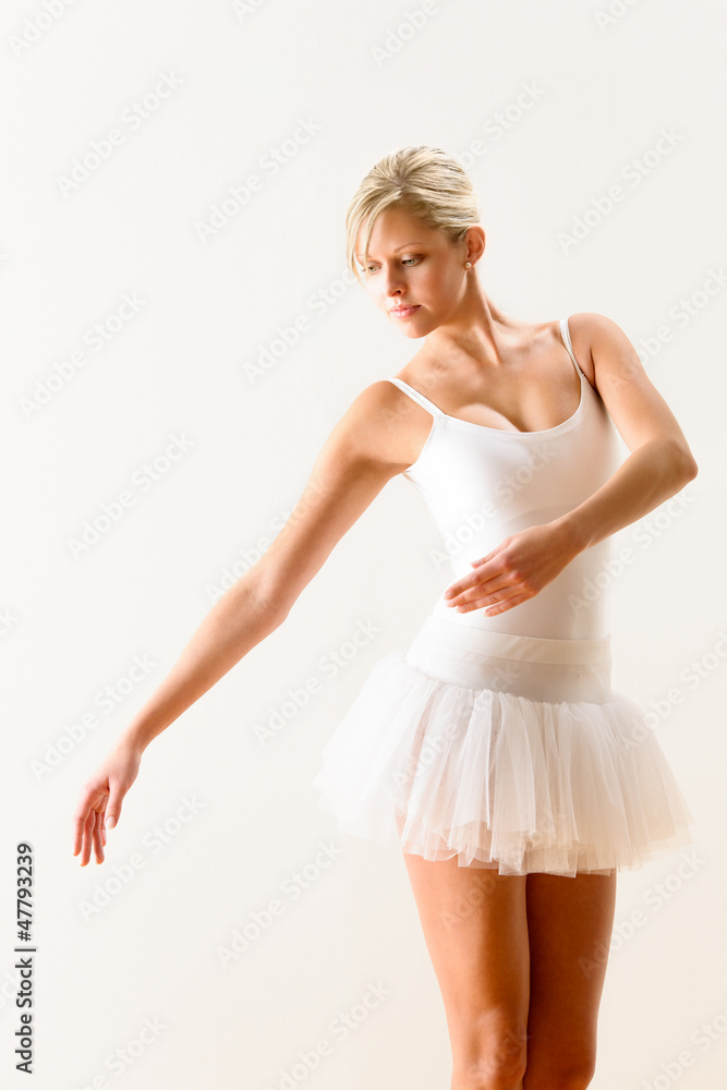 Ballet dancer exercising dance move in studio Ballet dancer exercising dance move in studio
