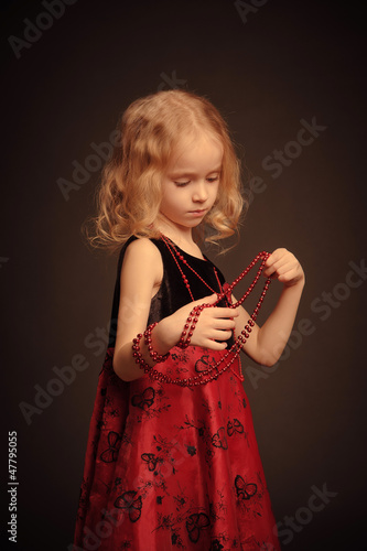 Little girl with beads