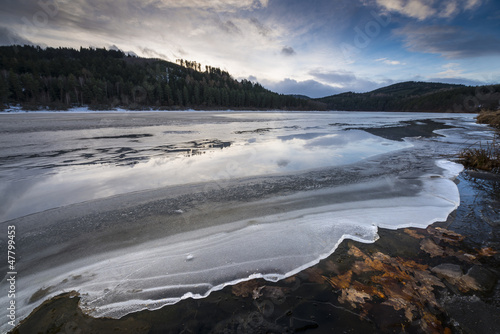 a beautiful lake with an ice in the winter time © Vera Kuttelvaserova
