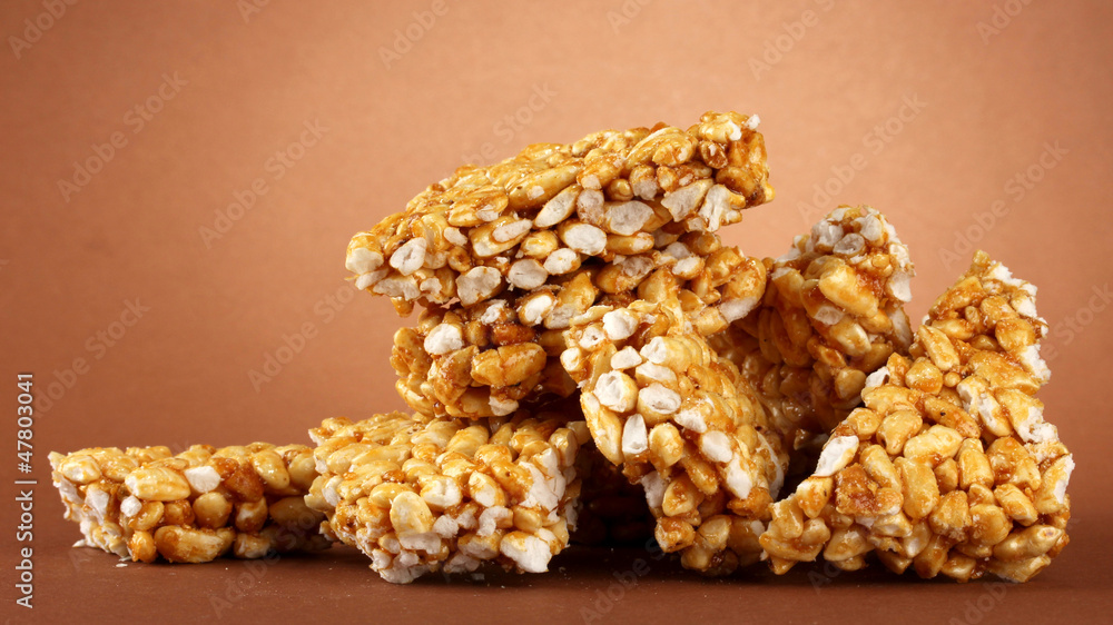 tasty sweets (kozinaki), on brown background
