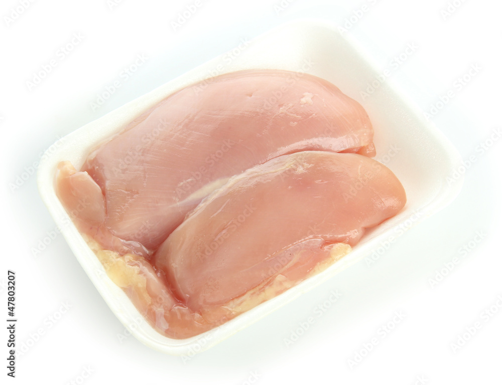 raw chicken meat in plastic tray isolated on white