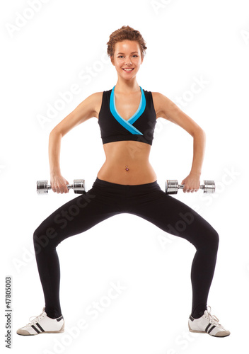 Girl squats with dumbbells