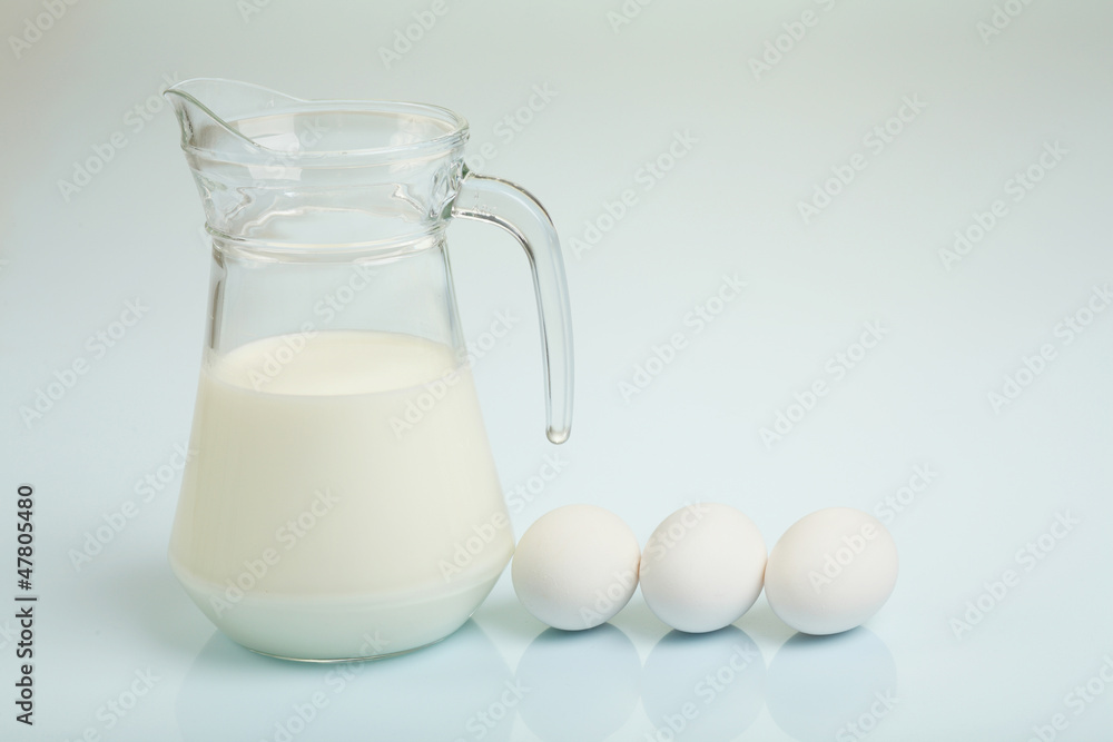 Milk in a glass jar and eggs Milk in a glass jar and eggs