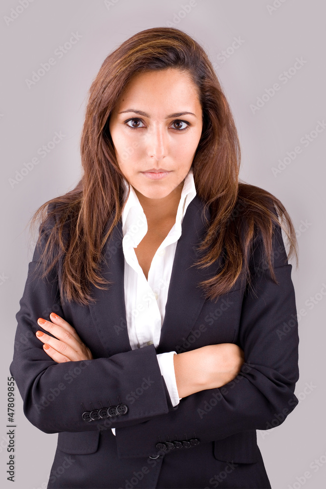 Portrait of confident young business woman on grey background Portrait of confident young business woman on grey background