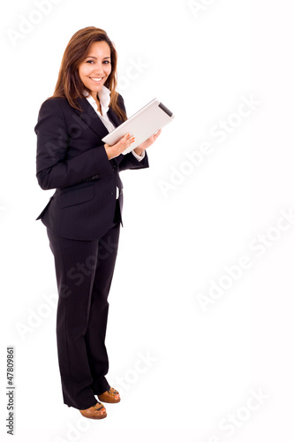 Full length portrait of a young businesswoman using touch pad ta