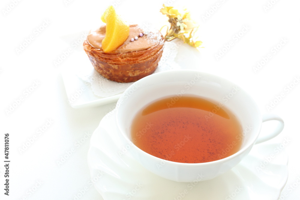 English tea with pastry cake on background English tea with pastry cake on background