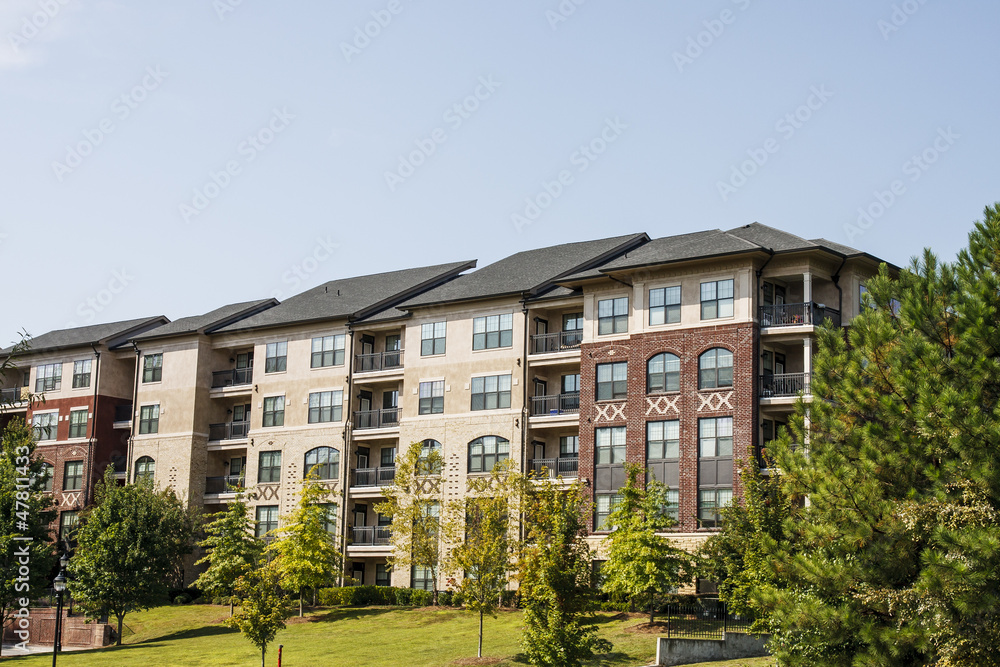 New Brick and Stucco Apartments and Pines