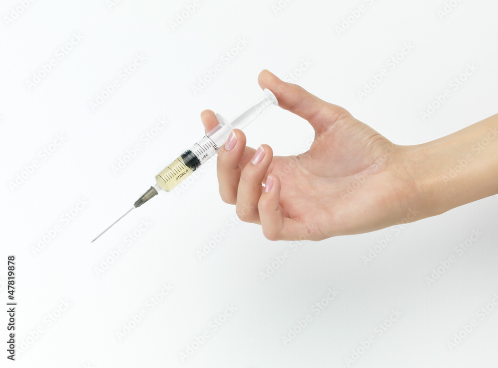 hand with syringe hand with syringe