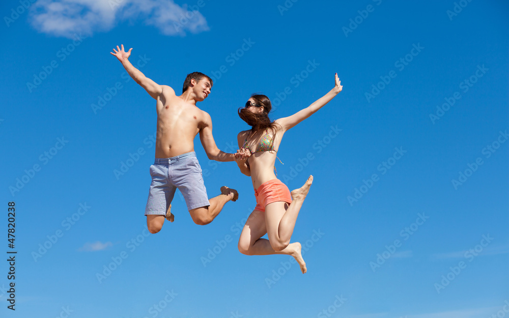 Happy Young Couple Together On The Beach