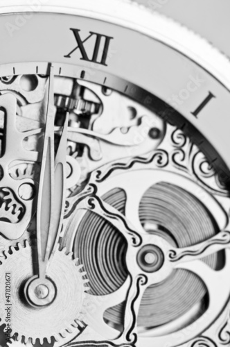 black and white close view of watch hands and mechanism