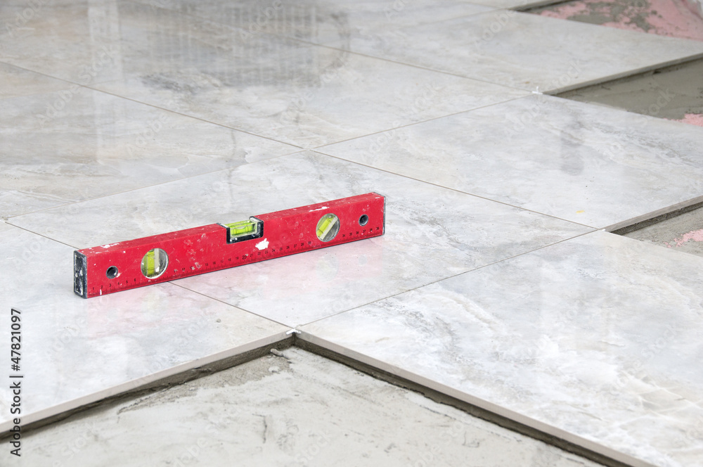 Fototapeta premium level gray Tiles on a floor