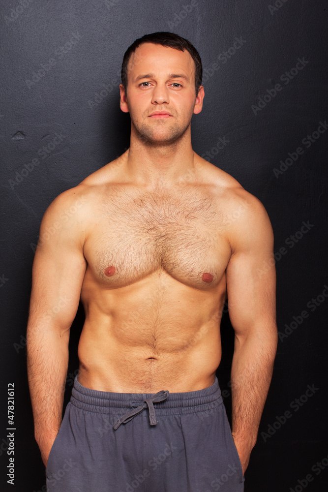 Obraz premium Handsome man with naked torso posing