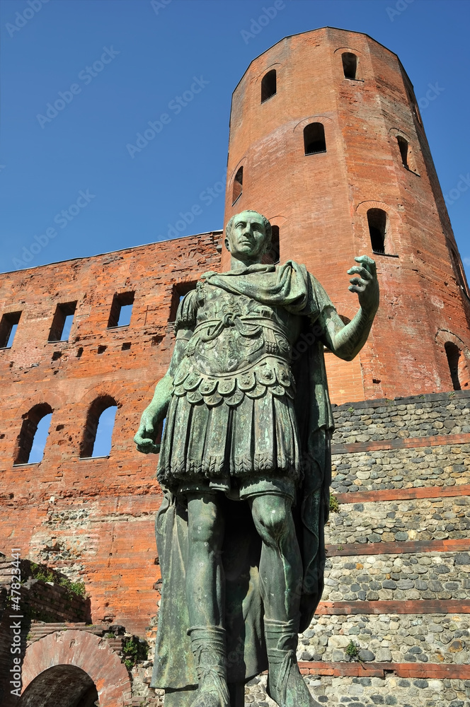 statue of roman imperor on front of porta palatina