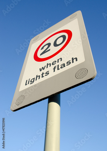 20mph speed limit sign on blue sky background