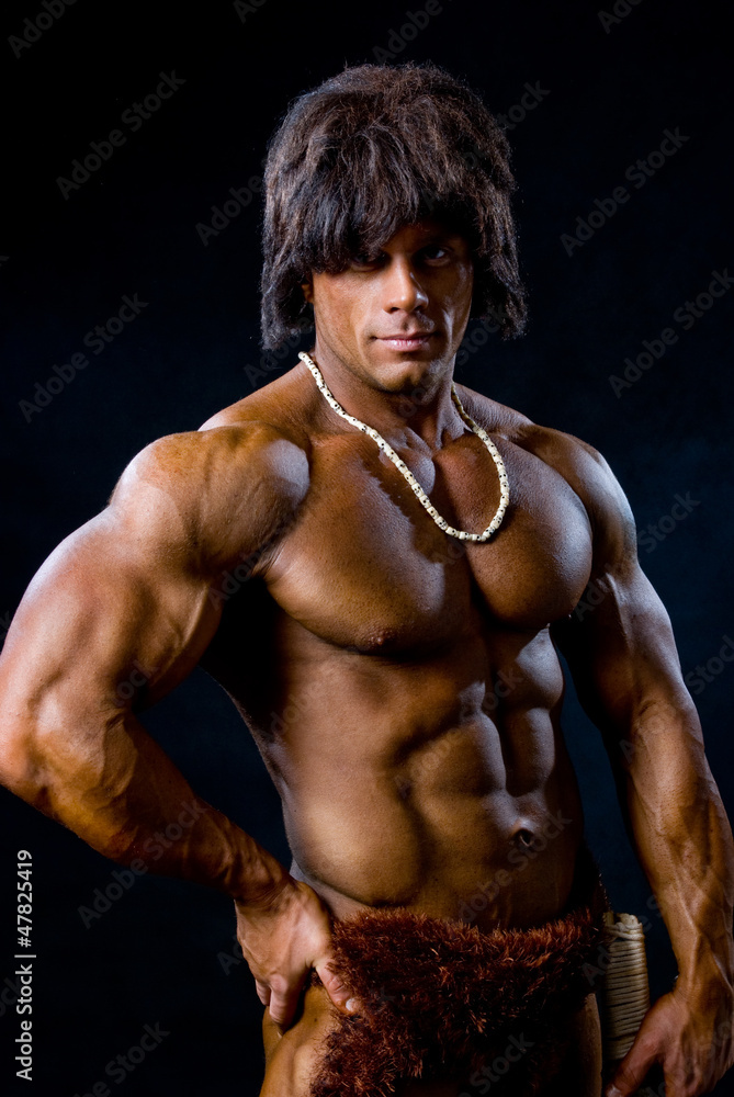 Portrait of a muscular man with unusual beads on her neck Portrait of a muscular man with unusual beads on her neck