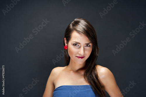 Beautiful woman on black background with long hair